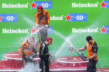 SHANGHAI (China), 23/03/2025.- Winner McLaren driver Oscar Piastri (top) of Australia, second placed McLaren driver Lando Norris (L) of Britain, third placed Mercedes driver George Russell (C) of Brit